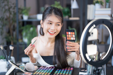 beauty blogger Young Asian girl makeup artist Professional Woman blogger vlogger is showing...