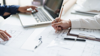 Architecture drawing on architectural project business architecture building construction Colleagues designer Planning Design on blueprint and compasses