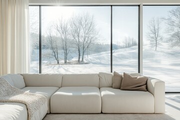 Modern sectional sofa in bright living room with large windows overlooking snowy winter landscape.