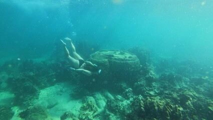under water young woman snorkeling on tailand