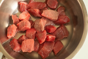 Frying chopped meat in a metal pan