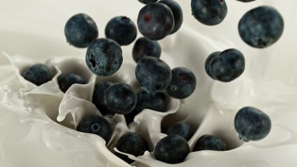 Pouring Blueberries Into Cream, Splashing, Top View Composition.