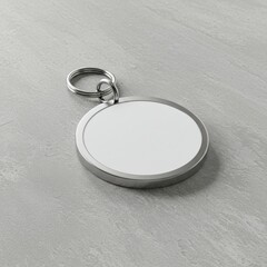 Blank Round Metallic Keychain Mockup on a Neutral Gray Surface for Branding or Custom Design