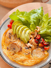 Onion omelette with avocado for breakfast. Delicious food. Cooking recipes. Bruch menu. Healthy recipes. Easy home cooking. Diet food dish. High Protein. eggs recipe. Breakfast tray. Fluffy omelet. 