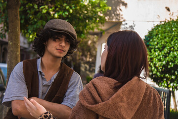 young couple arguing angrily on the street