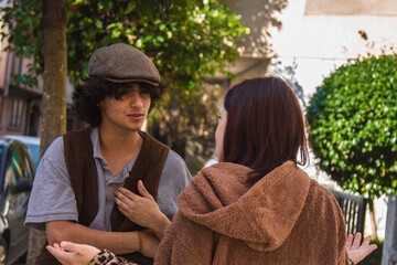 young couple arguing angrily on the street