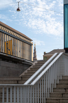 Urban Stairway with a View of Historic Spire in Copenhagen