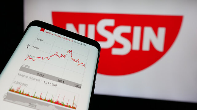 Stuttgart, Germany - 01-14-2025: Mobile phone with website of Japanese company Nissin Foods Holdings Co. Ltd. on screen in front of logo. Focus on top-left of phone display.