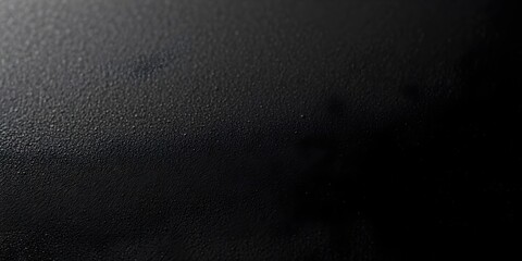 Fototapeta premium A deep black leather texture with subtle grain details, providing a luxurious and professional look, perfect for branding, backgrounds, product mockups, and high-end graphic design.