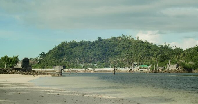 A view of the unfinished bridge supposedly connecting Union Road and nearby communities to Secret Beach in Siargao island, Philippines.