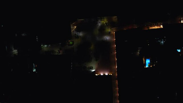 As the drone rises, the expansive view of Mompox at night unfolds.