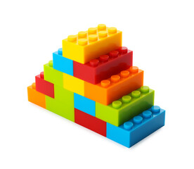 Construction toy. Pyramid made with building bricks isolated on white