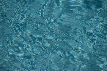 Water for graphic design. Swimming pool water. Surface of pool water. Blue ocean or sea water for background. Top view of pool.