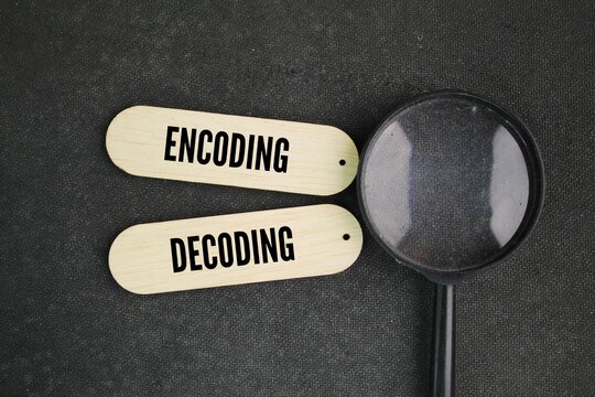 magnifying glass and stick with the words encoding and decoding. A model of encoding or decoding communication appears in rough form