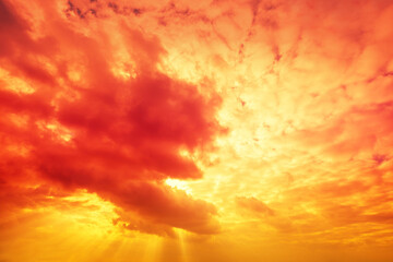 Flaming cloudy sky at sunset. Color gradient. Sky texture. Abstract nature background