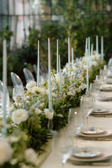 Modern stylish wedding table setting. The wedding decor. The pastel colors flowers bouquet. Natural...