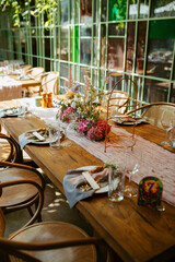 Modern stylish wedding table setting. Fairytale wedding decoration. Vibrant colors, vintage style. The pastel colors flowers bouquet. Natural beautiful wedding table setting  