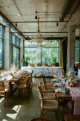 Modern stylish wedding table setting. Fairytale wedding decoration. Vibrant colors, vintage style. The pastel colors flowers bouquet. Natural beautiful wedding table setting  