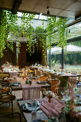 Modern stylish wedding table setting. Fairytale wedding decoration. Vibrant colors, vintage style. The pastel colors flowers bouquet. Natural beautiful wedding table setting  