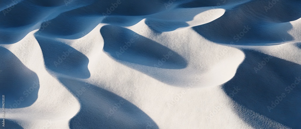 Poster wind-blown patterns form beautiful shapes in desert dunes at sunset