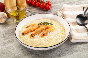 Italian risotto with prawn served thyme