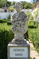Obraz premium Stone statue depicting the twins sign belonging to the episcopal garden of the city of Castelo Branco-Portugal.