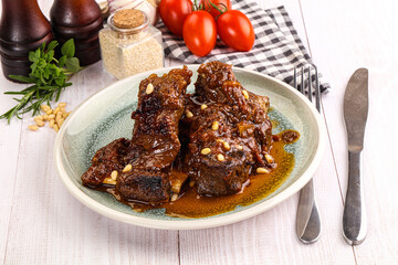 Prepared tasty beef ribs with sauce