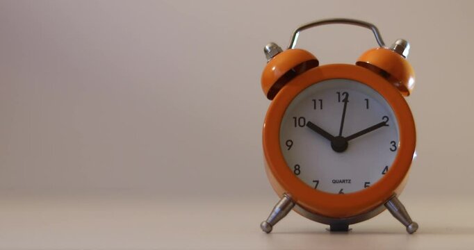 Orange The clock sets the time to 10.00. on white background 4k
