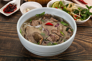 Vietnamese Pho Bo soup with beef and noodles