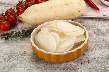 Sliced white daikon radish in the bowl