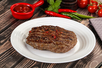 Grilled beef burger cutlet with sauce