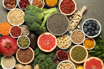 Superfood. Different healthy food products on grey table, flat lay