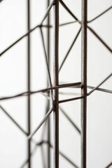 Dark metal rods form geometric lattice.