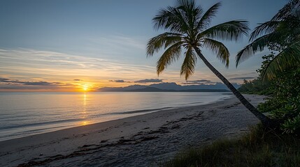Fototapeta premium Tranquil Tropical Beach Sunset with Silhouetted Palm Tree Picturesque Coastal Landscape at Golden Hour with Glowing Sky and Ocean Reflection