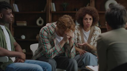 A woman shares her grievances about her husband during a group therapy session, seeking understanding and support in a collaborative setting