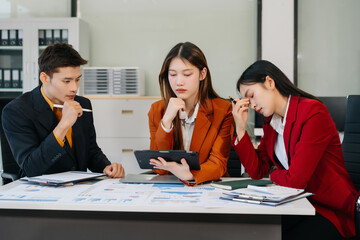 Businessman team working are under stress from financial data and report graph.