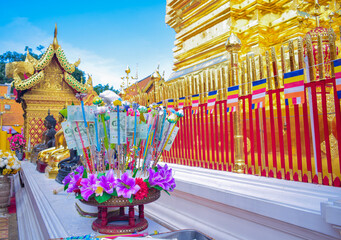 Each folded bill carries the donor’s wishes for merit and blessings.