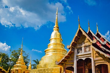 Fototapeta premium The golden pagoda shines brightly under the sunlight, symbolizing enlightenment. 