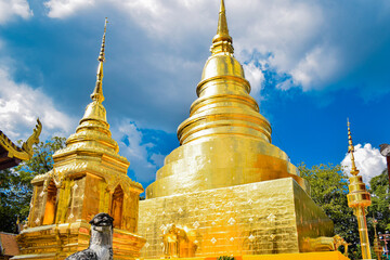 Fototapeta premium The golden pagoda shines brightly under the sunlight, symbolizing enlightenment. 