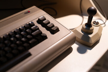 Retro computer and joystick on a desk © macondos