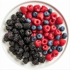 A platter of assorted fresh berries including blueberries, raspberries, and blackberries