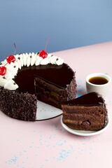 Chocolate Cherry Cake with Coffee on Pink Background