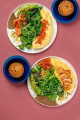 Dual Gourmet Breakfast Plates with Vibrant Greens