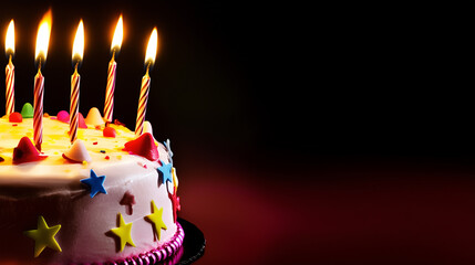 Festive birthday cake with colorful decorations, lit candles, and a dark dramatic background, perfect for celebration-themed designs, party invitations, and joyful event promotions