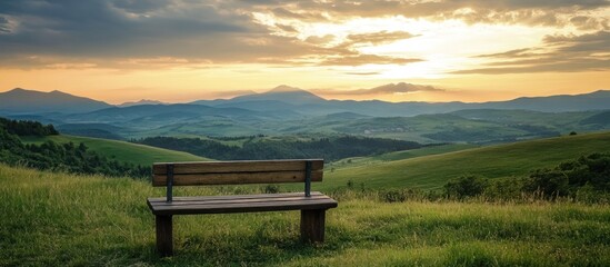 Tranquil Sunset View: Serene Mountain Landscape with Wooden Bench