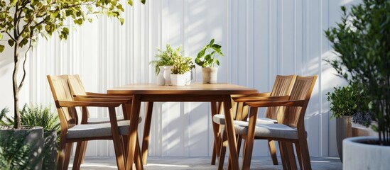 Fototapeta premium Serene Outdoor Patio Dining Set with Lush Greenery