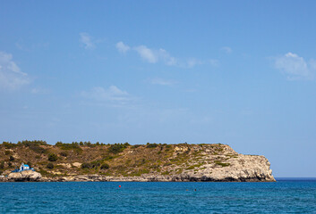 Naklejka premium Mediterranean sea washing the shores of the Kolympia beach on the island of Rhodes, Greece