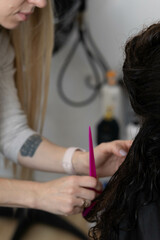 Hair treatment process at a salon with stylist and client