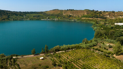 Aerial view of the lakeside of Lago d'Averno located in Pozzuoli, near Naples, Italy. It is a volcanic lake located in the Campi Flegrei. The lake is approximately circular.