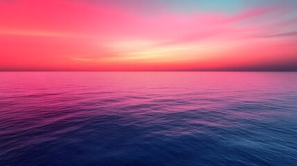 Obraz premium Vibrant pink and blue ocean sunset.